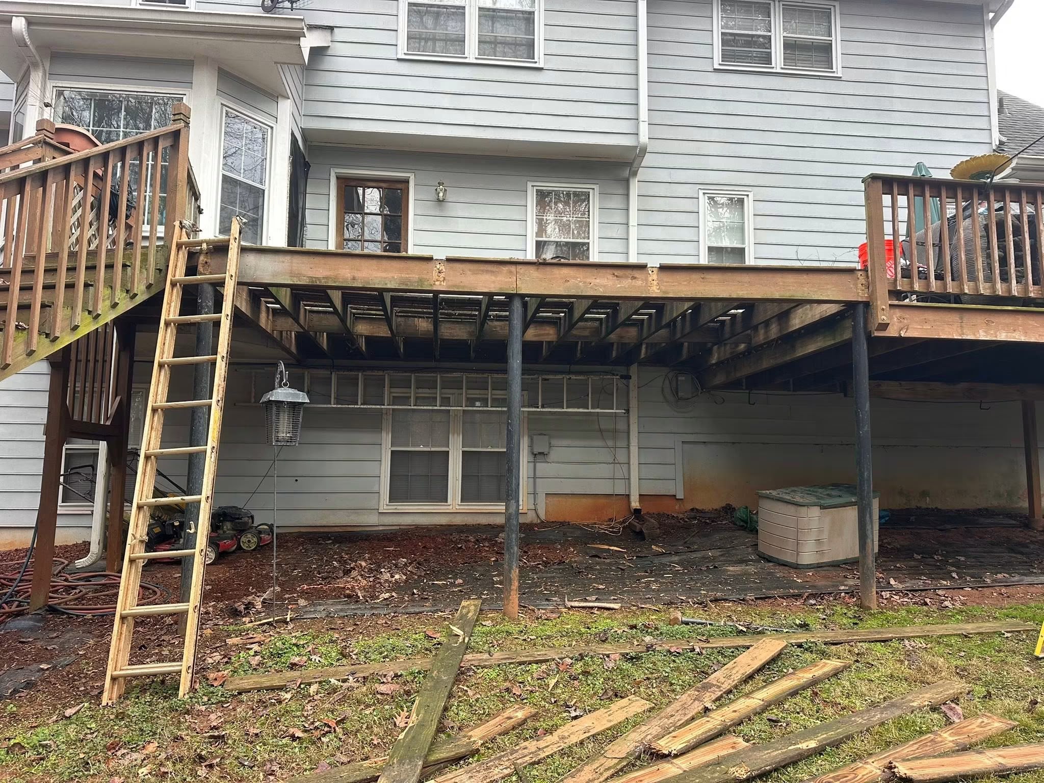 Before: weathered deck structure during demolition and rebuild